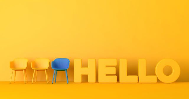 A row of chairs with the text Hello