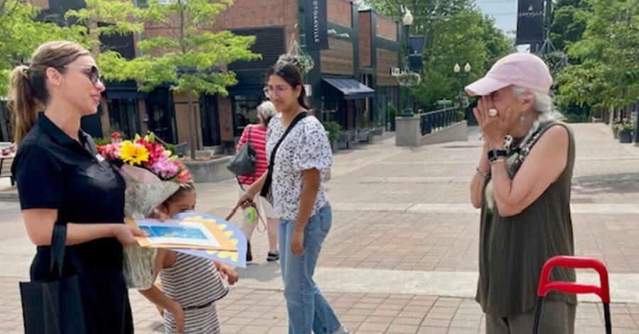 Charlene Luis surprises Maria Bell with an Oakville News Random Act of Kindness