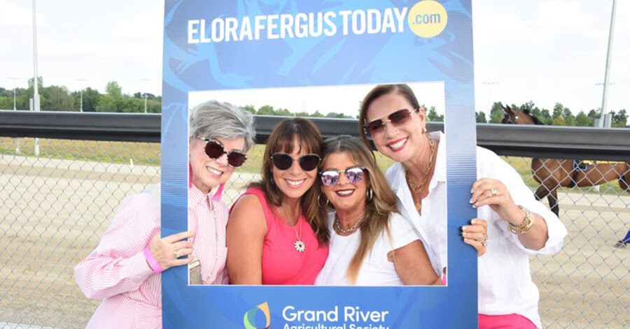 Fundraisers posing in a EloraFergusToday.com frame