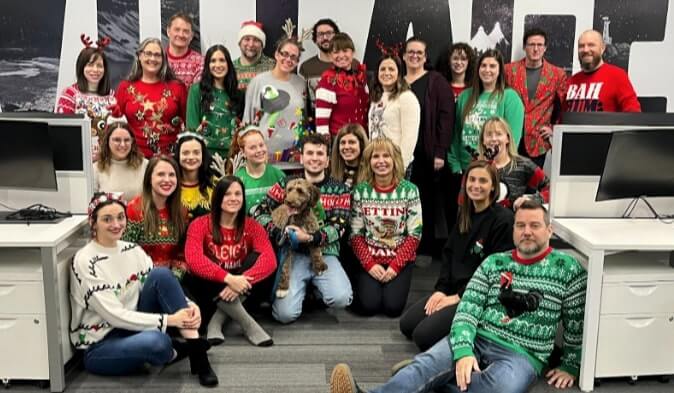 The SooToday team wearing their ugly christmas sweaters