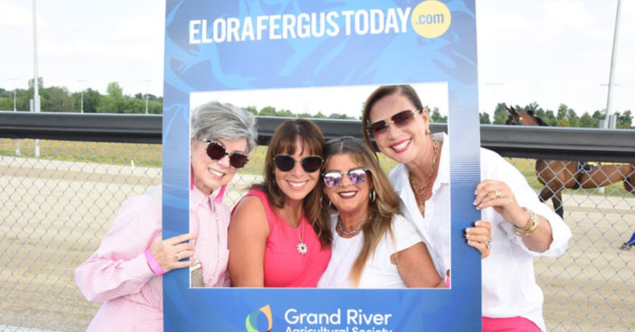 Fundraisers posing in a EloraFergusToday.com frame