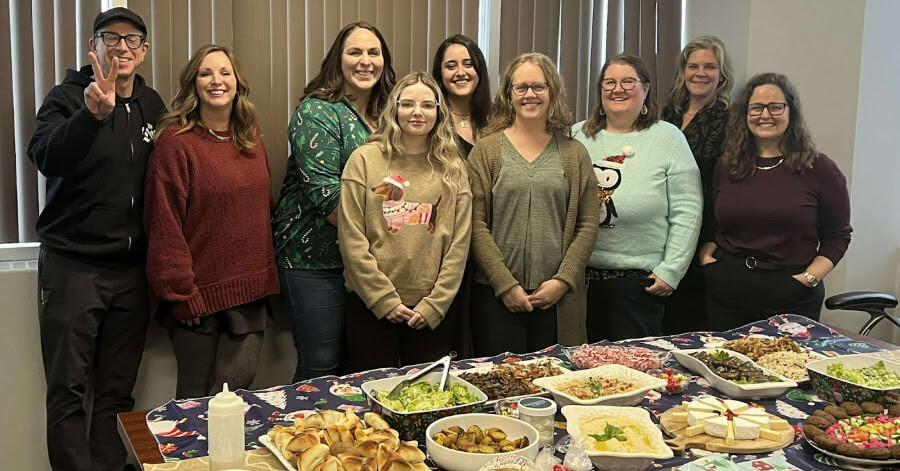 Sudbury.com and NorthernOntarioBusiness.com staff members are seen here with the delicious spread of hummus, baba ganoush, schwarma and more during their holiday party.