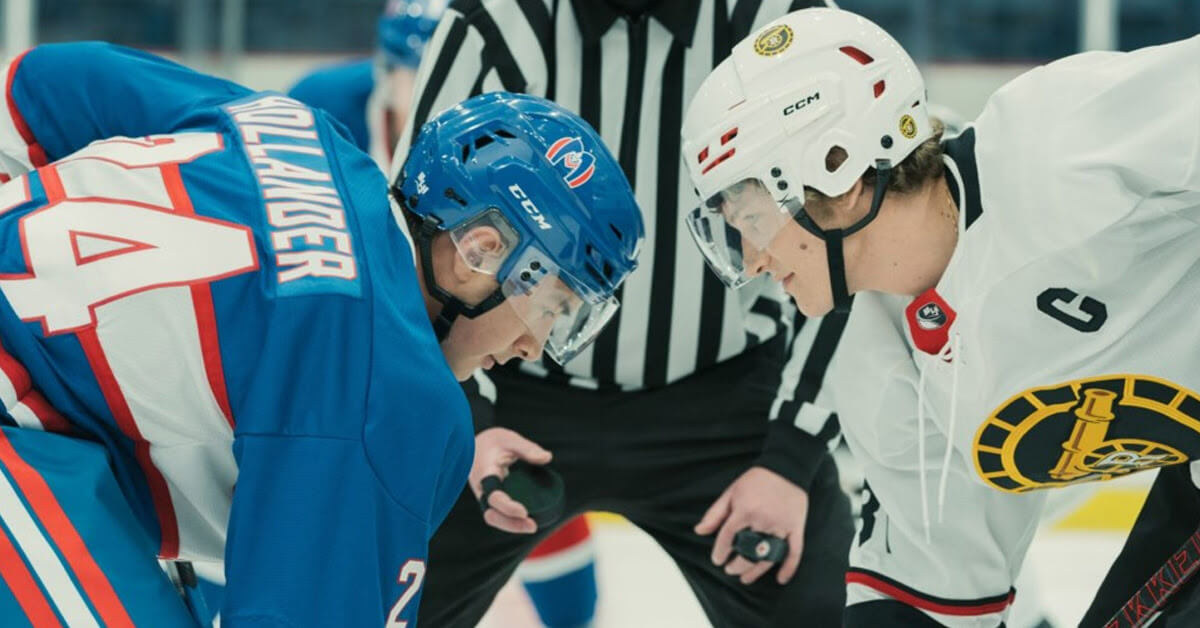 Still from the TV series, "Heated Rivalry" showing two hockey players facing off