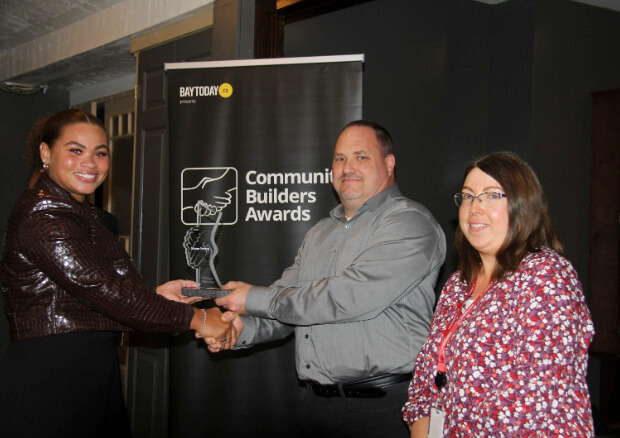 Simone Branch, winner of the Young Leader award, accepts her statue at the BayToday Community Builders Awards reception