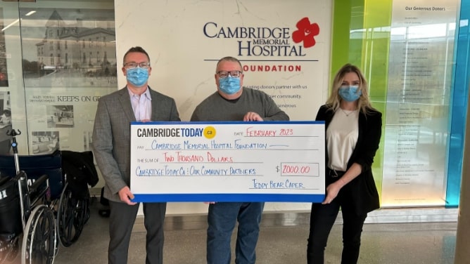 CambridgeToday’s Mike Johnston and Mac Sinclair deliver the donation from our Teddy Bear Caper to Taylor Patterson from the Cambridge Memorial Hospital Foundation