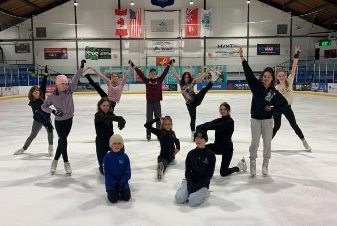 Collingwood Skating Club posing on ice