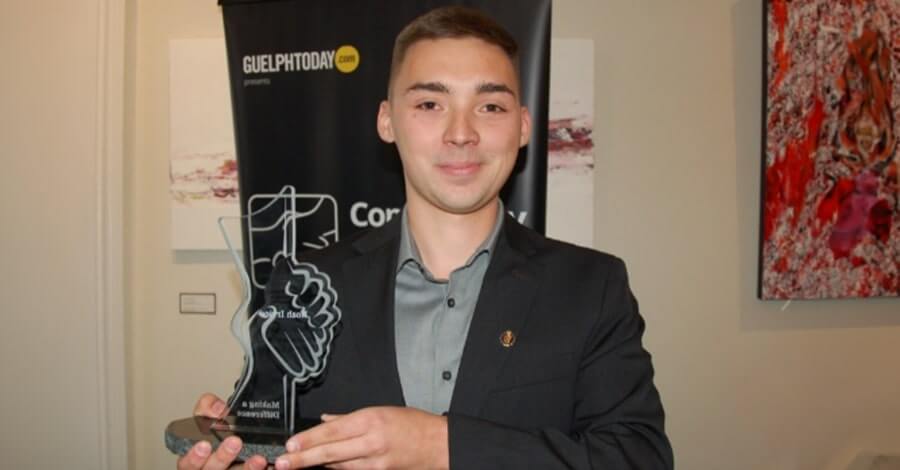 Noah Irvine accepts this year's GuelphToday Community Builders Awards in the Young Leader category. Photo by Richard Vivian/GuelphToday