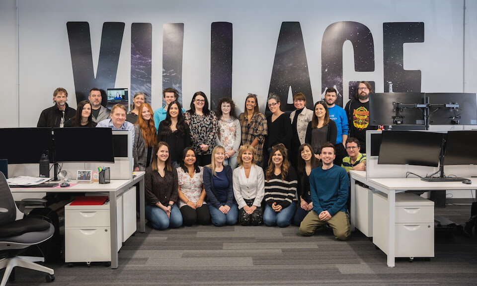 Group shot of the Village head office team, plus Brett Luft via laptop.